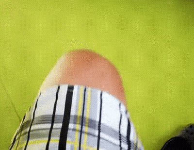 Person In Plaid Shirt On Green Floor GIF