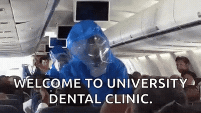 Person In Protective Suit On Plane GIF