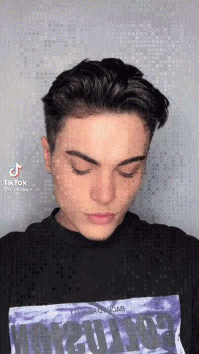 Person In Rainbow Sunglasses Taking Selfie With TikTok Logo GIF