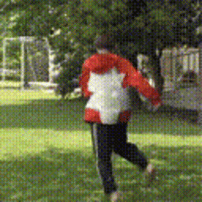 Person In Red And White Jacket Running In Grass GIF