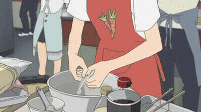 Person In Red Apron With Carrot Preparing Food GIF