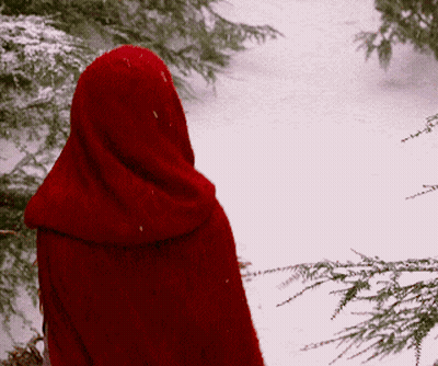 Person In Red Cape Standing In Snow GIF