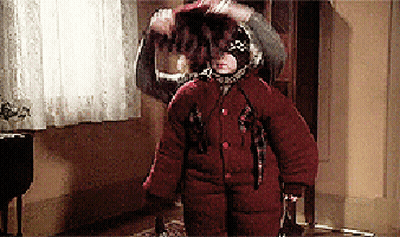 Person In Red Coat Standing In Hallway GIF