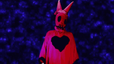 Person In Red Costume With Skull And Heart GIF