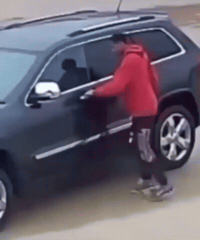 Person In Red Jacket Getting Out Of Black SUV GIF
