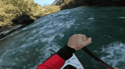 Person In Red Jacket Holding Paddle GIF