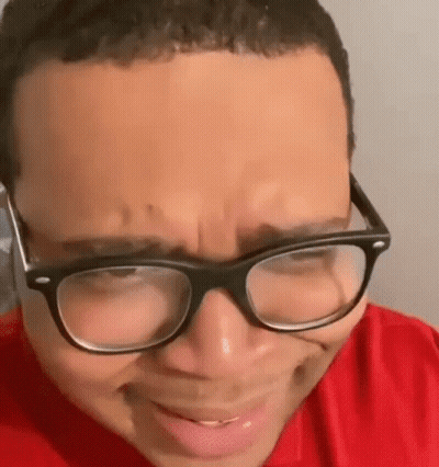 Person In Red Shirt And Glasses GIF