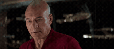 Person In Red Shirt Holding Gun By Fountain GIF