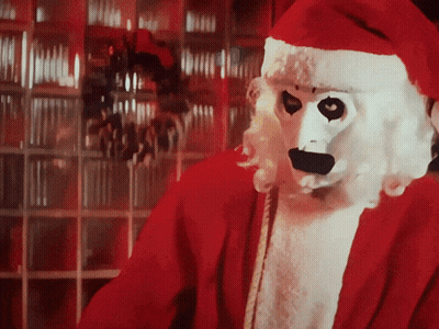 Person In Santa Costume With White Mask GIF