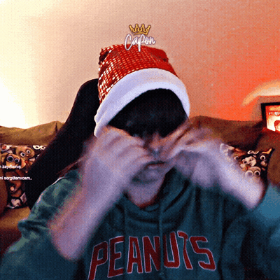 Person In Santa Hat And Peanuts Shirt GIF