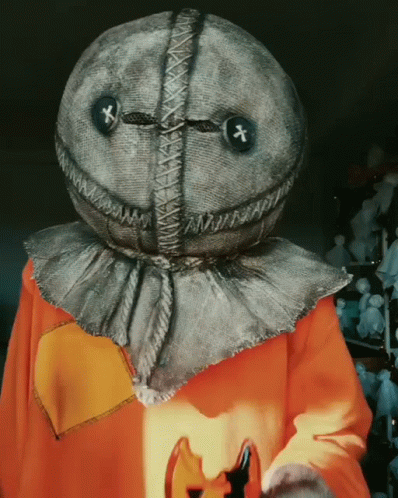 Person In Scarecrow Costume Holding Pumpkin GIF