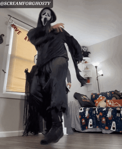 Person In Scream Costume Dancing In Living Room GIF