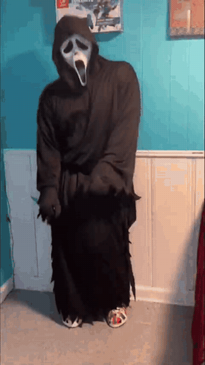 Person In Scream Costume Holding Knife GIF