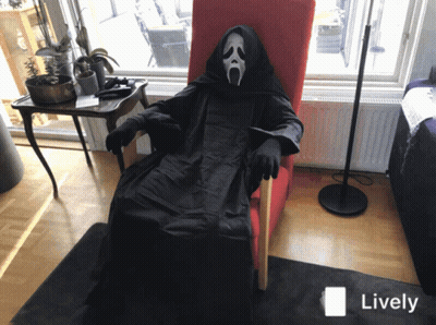 Person In Scream Costume Sitting In Chair GIF