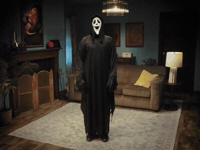 Person In Scream Costume Standing In Living Room GIF