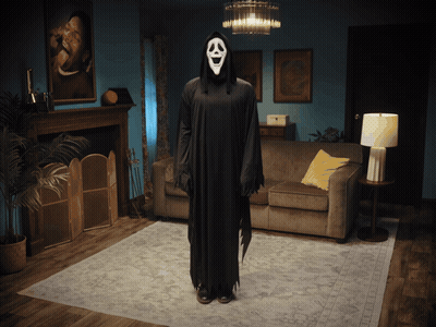 Person In Scream Costume Standing In Living Room GIF