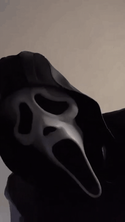 Person In Scream Mask And Black Hood GIF