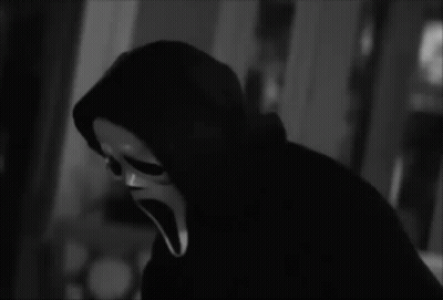 Person In Scream Mask Holding Knife GIF
