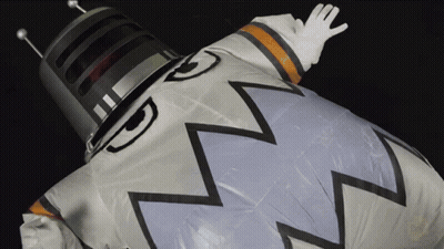 Person In Space Suit With Helmet And Gloves GIF