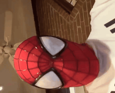 Person In Spider-Man Mask Laying On Bed GIF