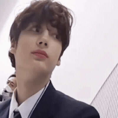 Person In Suit And Tie Looking At Camera GIF