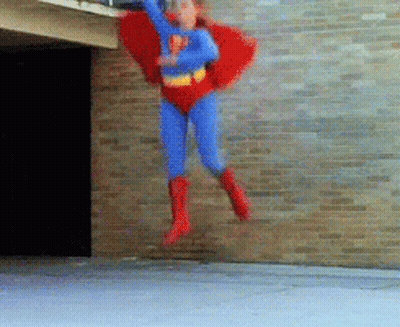 Person In Superman Costume Flying GIF
