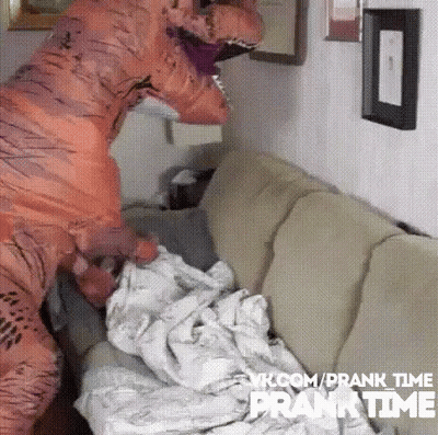 Person In T-Rex Costume On Couch GIF