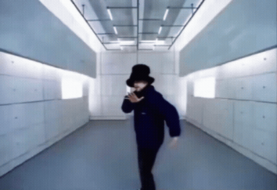 Person In Top Hat Dancing In Hallway GIF