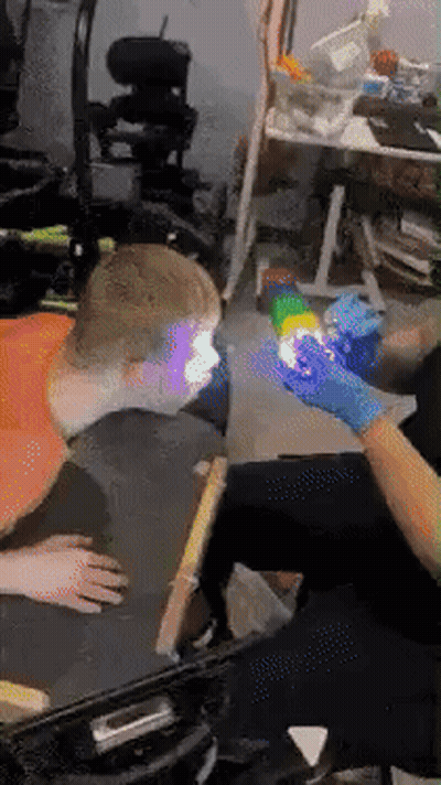Person In Wheelchair Getting Arm Tattoo GIF