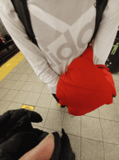 Person In White Adidas Shirt Holding Red Bag GIF