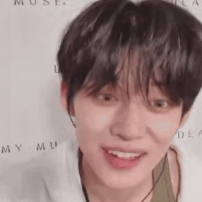 Person In White And Green Shirt Close Up GIF