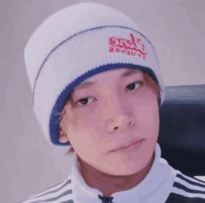 Person In White Beanie And Black And White Jacket GIF