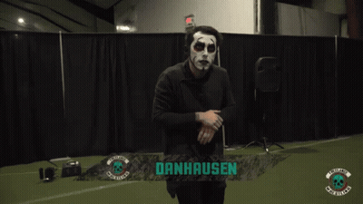 Person In White Hoodie In Front Of Machine GIF