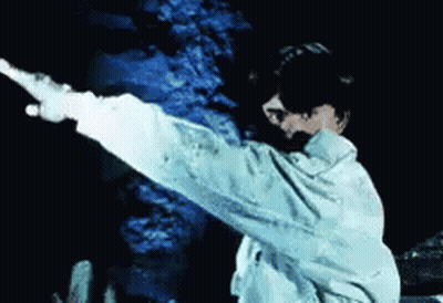 Person In White Jacket Pointing GIF