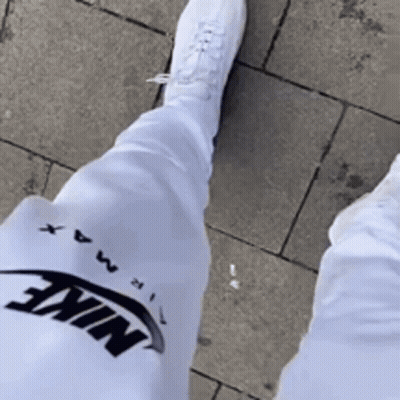 Person In White Nike Pants And White Shoes GIF
