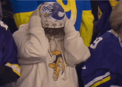 Person In White Sweatshirt With Vikings Logo GIF
