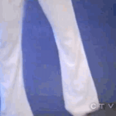 Person In White Walking On Blue Surface GIF