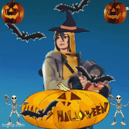 Person In Witch Costume Next To Halloween Pumpkin GIF