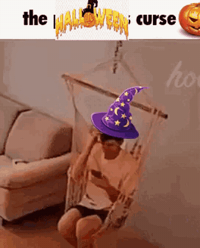 Person In Wizard Hat Sitting In Hammock GIF