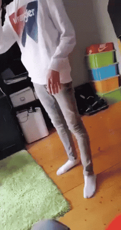Person In Wrangler Sweatshirt And Jeans Standing In Room GIF