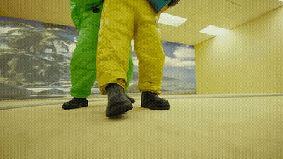 Person In Yellow And Green Pants Walking GIF