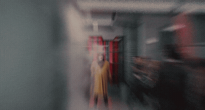 Person In Yellow Coat GIF