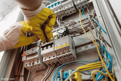 Person In Yellow Gloves Working On Electrical Box GIF