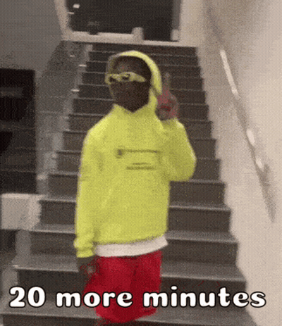 Person In Yellow Hoodie And Red Shorts On Stairs GIF