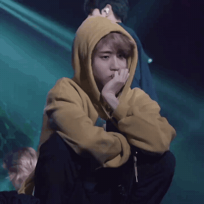 Person In Yellow Hoodie Covering Face GIF