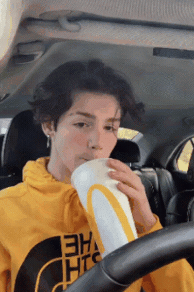 Person In Yellow Hoodie Drinking McDonald's Cup GIF