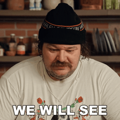 Person In Yellow Jacket Holding 25Ml Beaker GIF