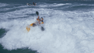 Person In Yellow Kayak Thrown Into Water GIF