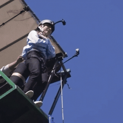 Person Jumping Off Cliff Into Water GIF
