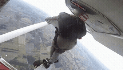 Person Jumping Out Of Plane With Emergency Exit Sign GIF